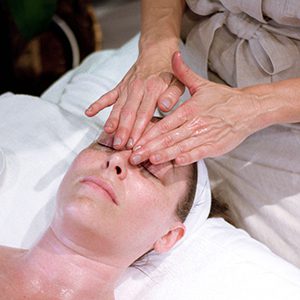 Forehead massage on a client during a relaxing facial
