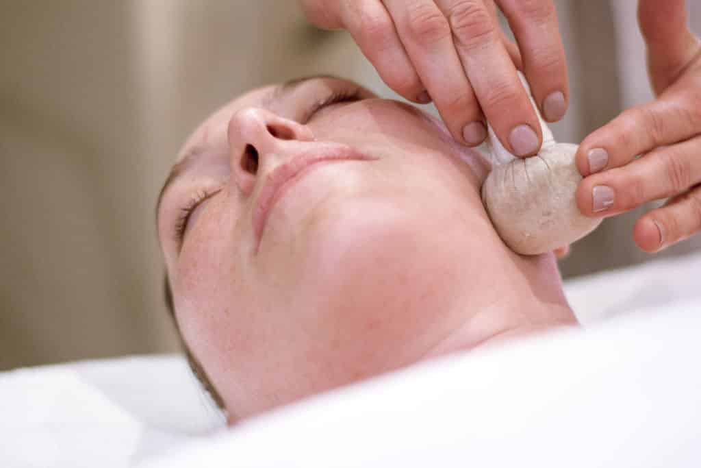 soothing poultice treatment during a facial at Big Sky spa