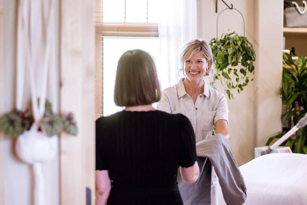 Owner Amy welcoming a client to Big Sky's best organic day spa